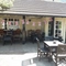 exterior beer garden of a pub with a seating area