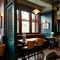 An interior restaurant seating area at The Richmond Arms, with wooden flooring, and an upholstered booth seat against the windows.
