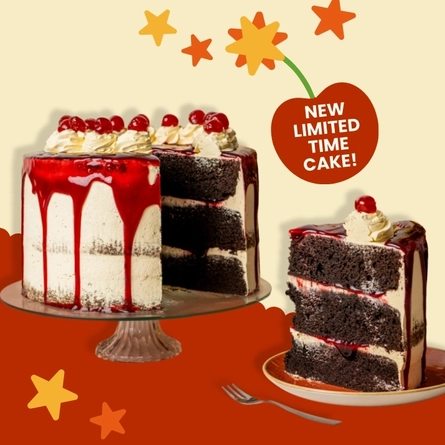 A banner showing the new Choc-N-Cherry Bomb cake served on a glass cake stand and topped with whipped cream or piped icing, cherries, and a red sauce which drips down the sides of the cake. The banner also shows an image of a slice of the cake served on a plate, below the words "New limited time cake!"; and the images are surrounded by yellow and orange stars.
