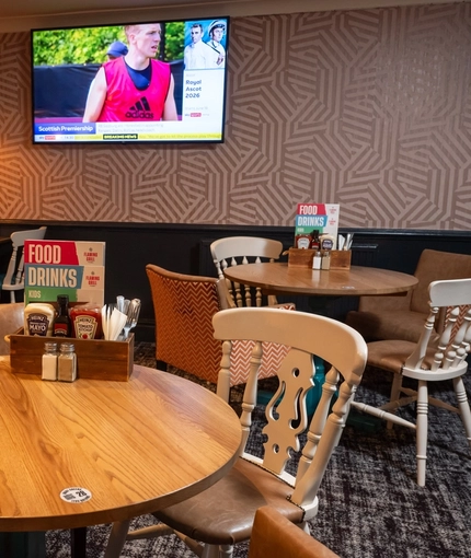 The interior restaurant and seating area with TV on the wall at the Man of Gwent.