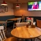 The interior restaurant and seating area with TV on the wall at the Man of Gwent.