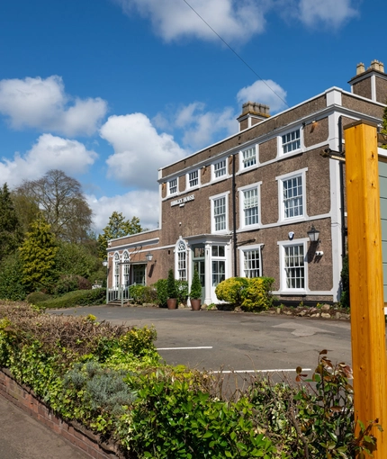 A sign for Himley House, outside of the building.