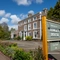 A sign for Himley House, outside of the building.