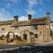 The exterior facade, signage and beer garden seating area of the Smiths Arms pub in Beckwithshaw.