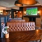 interior of the restaurant and seating area with TV