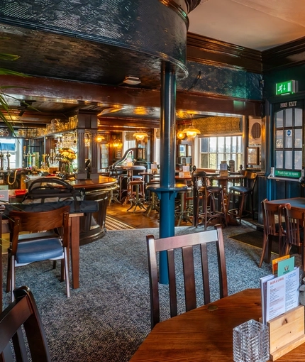 The interior restaurant seating area at The Sussex Arms.