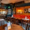 The interior restaurant seating area at The Sussex Arms.