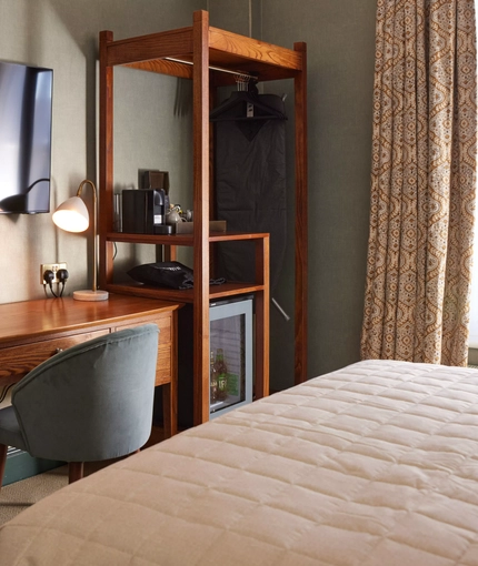 Hotel room dressing table with chair and mirror 