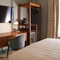 Hotel room dressing table with chair and mirror 