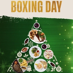 A Christmas banner promoting 'Boxing Day' at Flaming Grill venues.