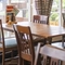 Interior dining area of a pub with a TV.