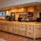 The interior bar area and cake cabinet with tiled flooring at The Farmhouse Kitchen Willington.