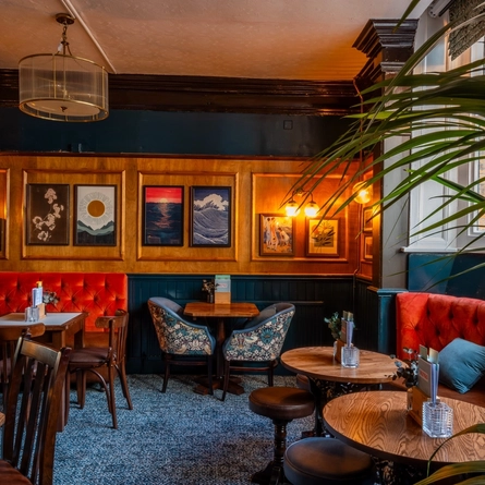 The interior restaurant seating area at The Sussex Arms.