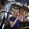 A woman pours a pint of beer from the beer taps at Shakespeares in Edinburgh.