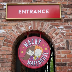 A close up view of the exterior signage of the Wacky Warehouse at The Stanley Ferry.