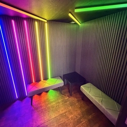 The interior of a Singpods Karaoke booth.