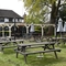 Exterior beer garden of a pub with a gazebo.