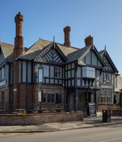 Exterior of the pub with the name above the entrance.
