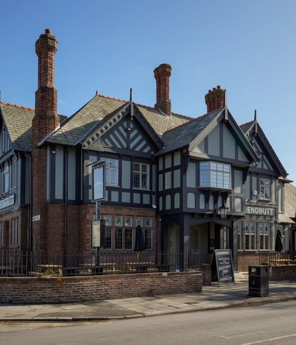Exterior of the pub with the name above the entrance.