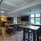Interior dining area of a pub with a TV.