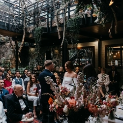 An interior shot of people celebrating a Wedding at the Ubiquitous Chip in Glasgow.