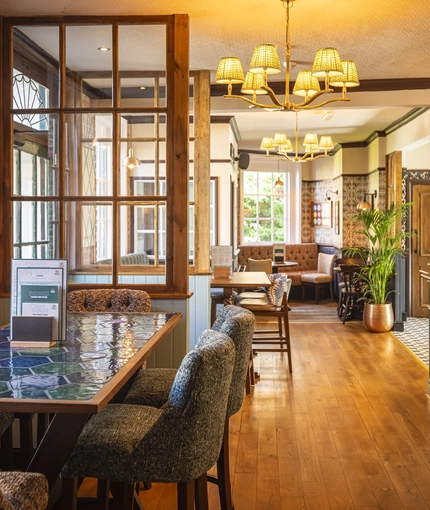 The interior bar and restaurant seating area at The Crown & Horseshoes.