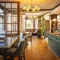 The interior bar and restaurant seating area at The Crown & Horseshoes.
