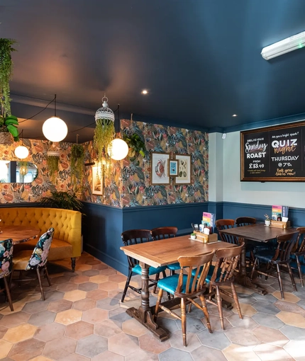 interior of the pub with dining tables and chairs