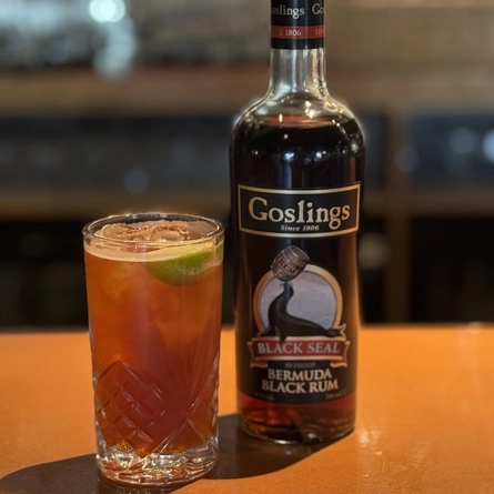 A bottle of Goslings Rum sat next to a Rum cocktail on a table to advertising a Goslings Sampling What's On event at Crafted venues.