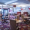 Interior dining area of a pub with TVs and claw machines.