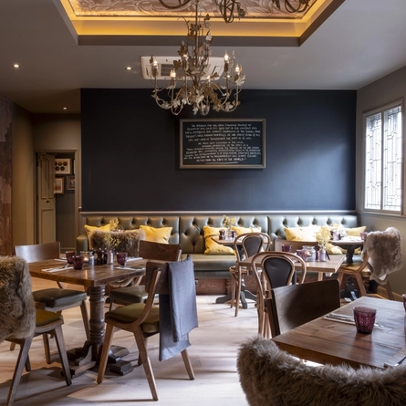 restaurant seating area with several tables set up for dining