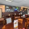 Interior dining area of a pub with a TV.