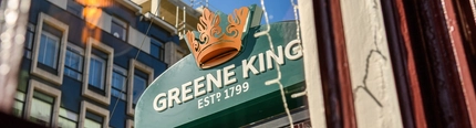 A view from inside the Coach & Horses of the pub sign which hangs on the exterior wall of the pub.