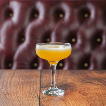 An advertising image of a Passionfruit Martini.