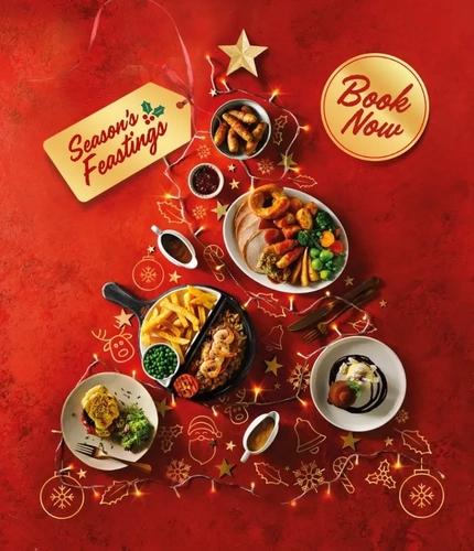 Plates of Flaming Grill food and fairy lights shaped like a Christmas tree, with a tag saying 'Season's Feastings' and 'book now' on a red background.