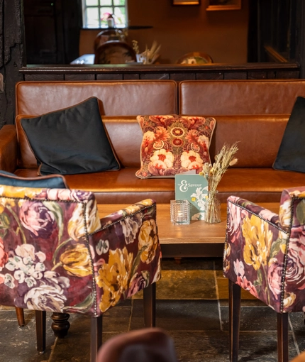 A table in the restaurant of the Three Horse Shoes.