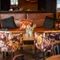 A table in the restaurant of the Three Horse Shoes.