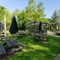 Exterior beer garden of a pub with a play area and a seating area.