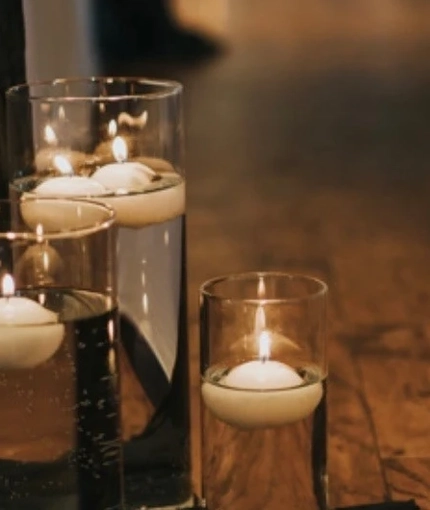 A close up view of some candles in the wedding event space at Windmill Farm.