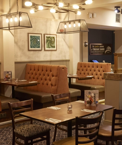 The interior restaurant seating area at The Caledonian Hotel.