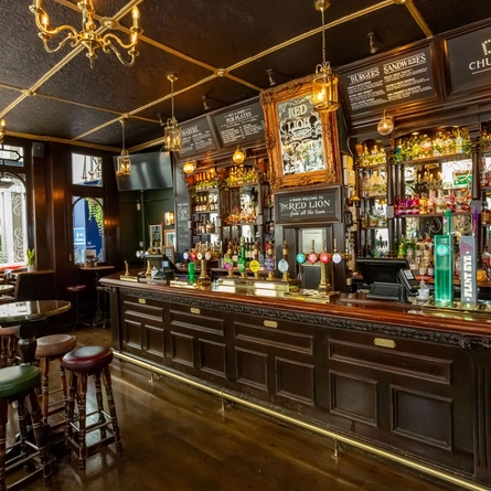 The interior bar with seating area at the Red Lion.