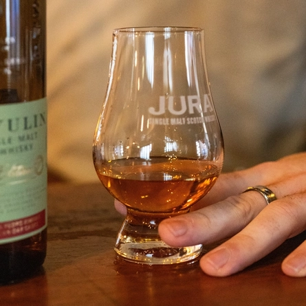 A glass of Jura single malt whiskey being poured behind the bar at the Ubiquitous Chip.