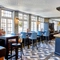 The bar and interior restaurant seating area with TVs and pub games, at The good Intent in Hornchurch.