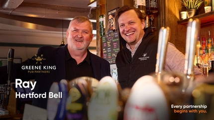 A Pub Partners banner showing 2 people stood behind the bar at The Hertford Bell.