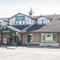Exterior facade of a pub with a seating area,