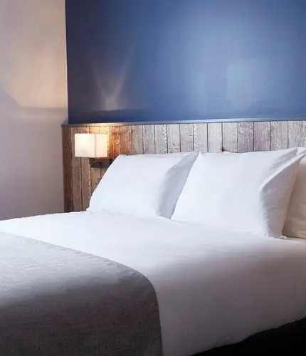 The interior of one of the hotel rooms featuring a double bed at The Churchill.