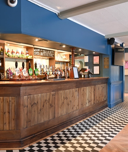 The interior bar with TV at The Greengage.