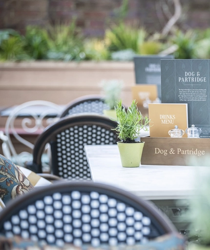 Some menus on a table in the beer garden of the Rothley Court Hotel.