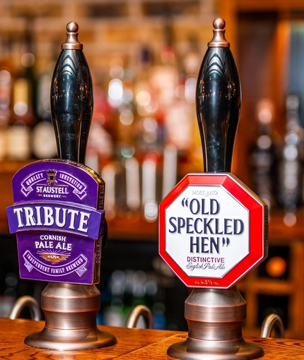 A close up view of the beer taps on the bar inside the Monument.