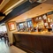 Interior bar area and dining area of a pub.